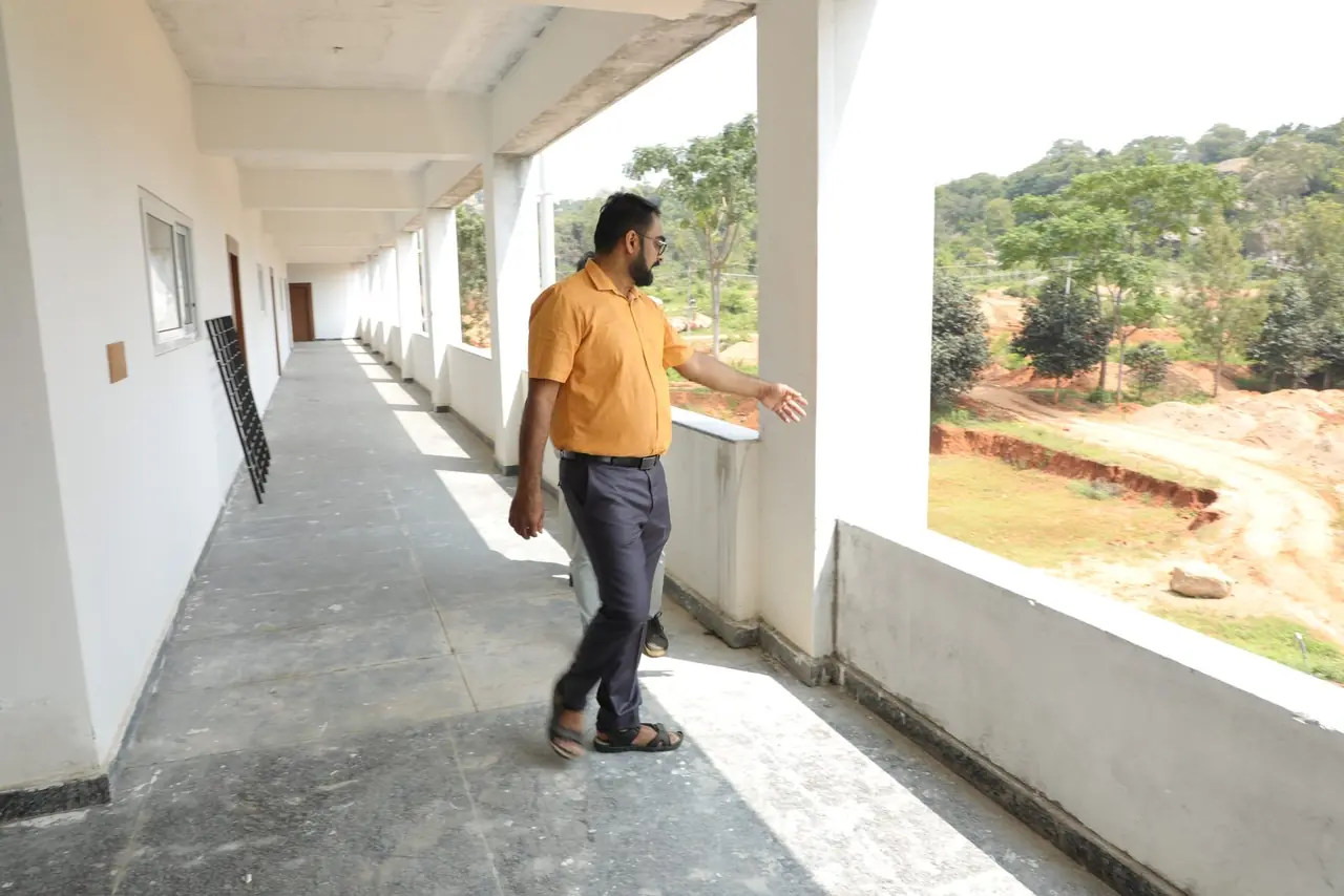 Corridor of the new academic block at Bachenahatti overlooking the campus land